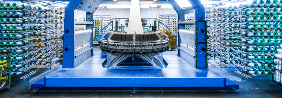 Eschbach, Produktion, Webstuhl, Gewebeherstellung, hochwertige Gewebe, textile Fertigung, innovative Webtechnik, zuverlässige Produktion, robustes Gewebe, industrielle Textilproduktion, langlebige Materialien, Webstuhlanlagen, Präzisionsgewebe, Produktionsprozess Eschbach